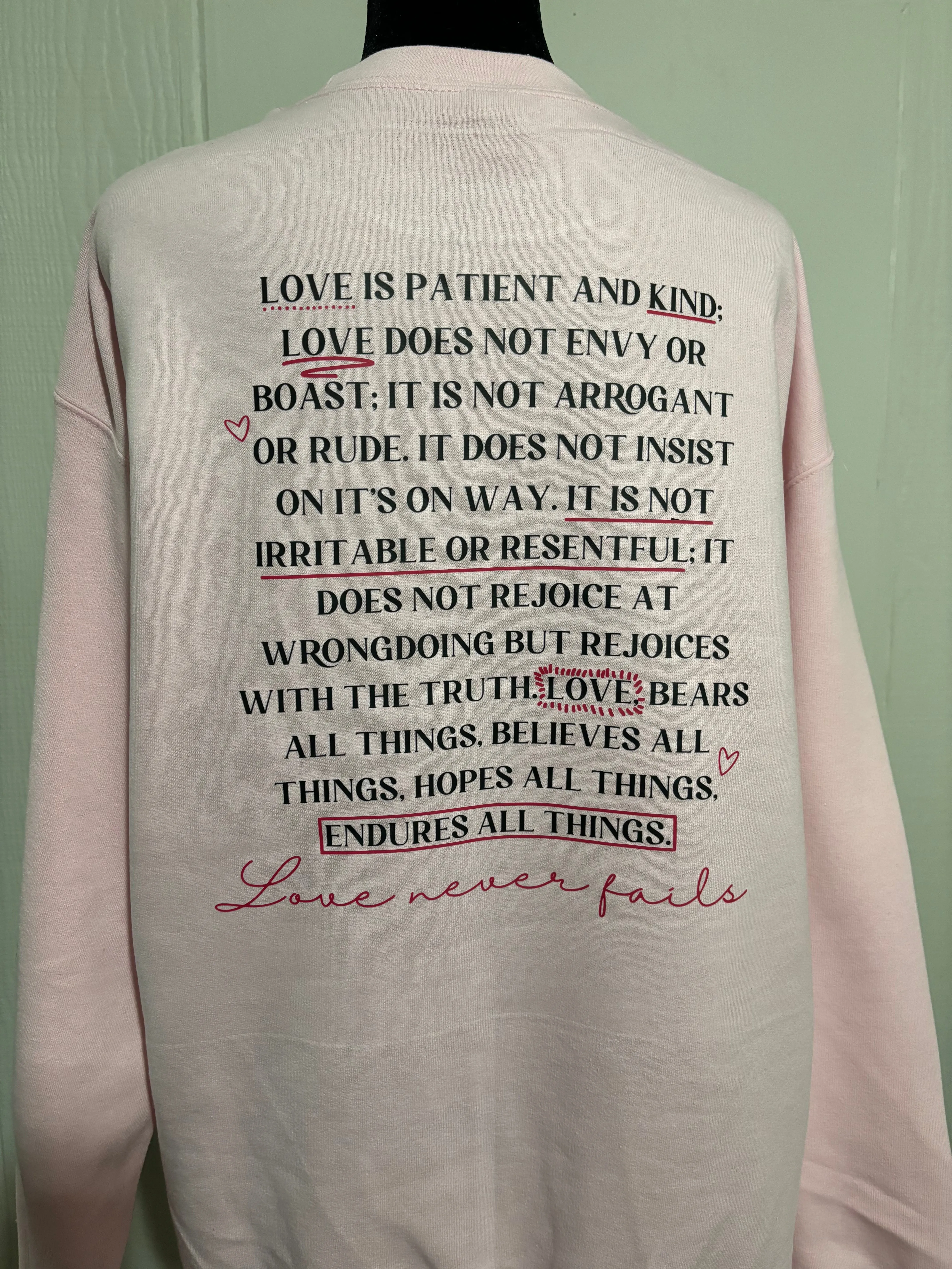 Love Never Fails Sweatshirt