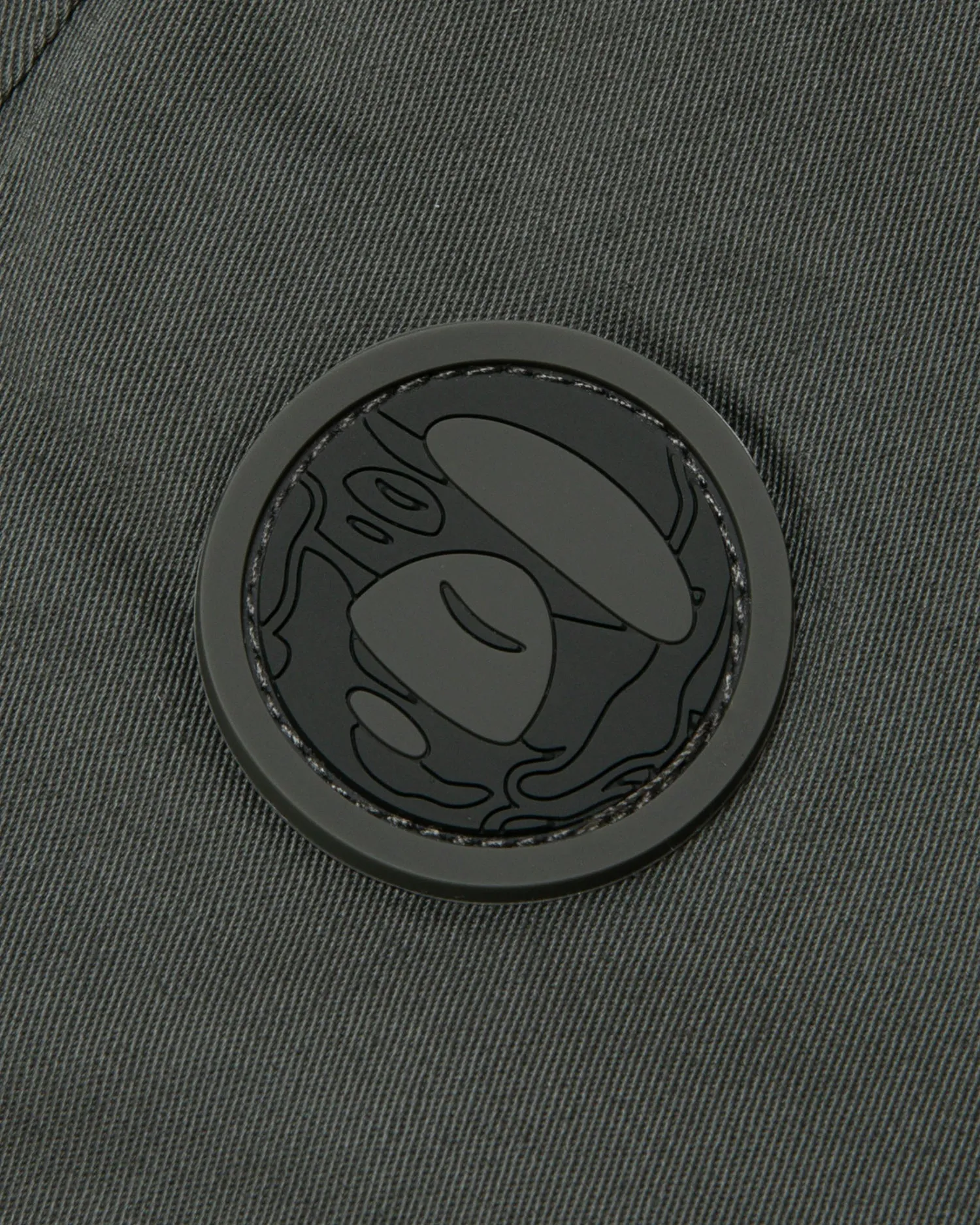 Moonface patch relaxed pants